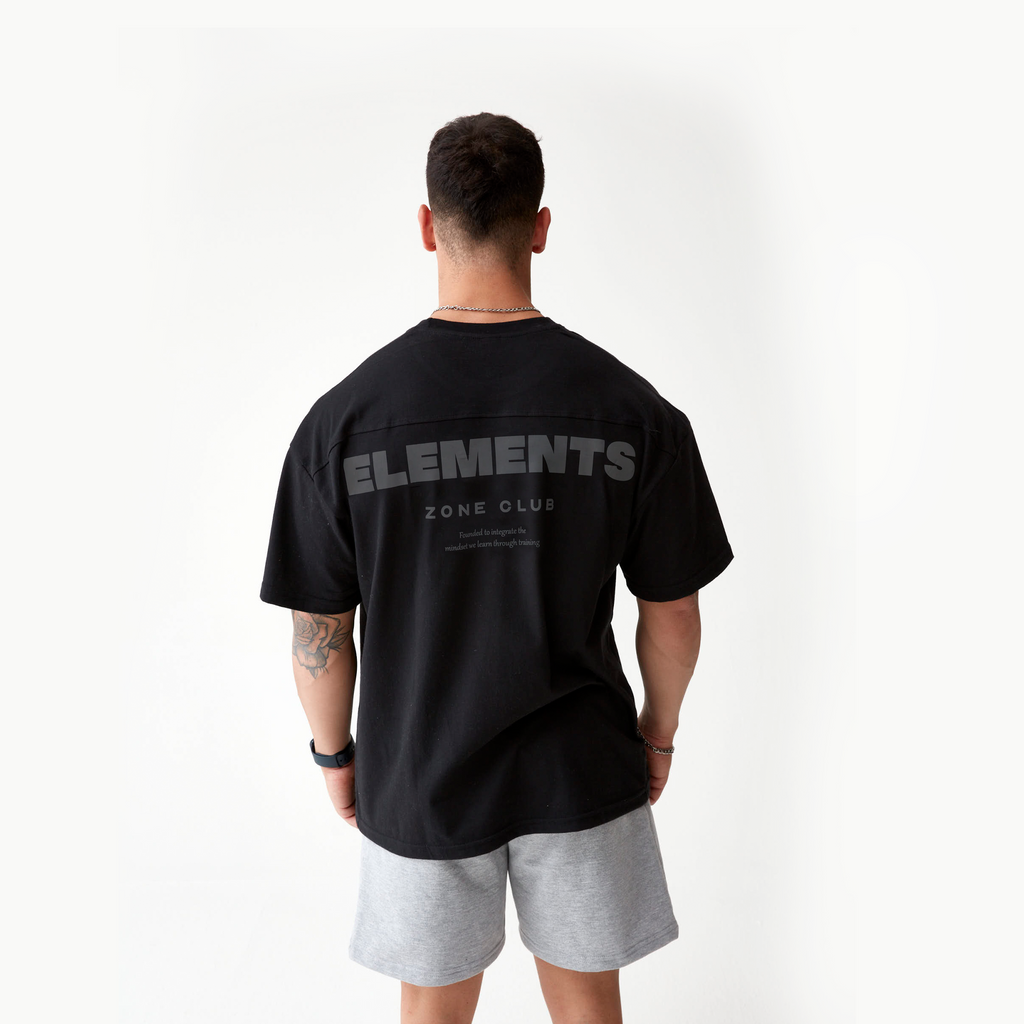 POLERA OVERSIZE ELEMENTS™ NEGRA (Bordado Blanco)