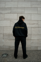 HOODIE MOTION™ NEGRO/AMARILLO